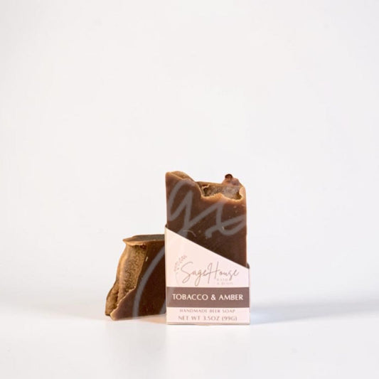A labeled bar of soap sitting in front of a matching bar. On a white background.
