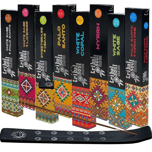 A collection of Tribal Soul incense sticks in various colored packaging, each labeled with different scents like White Sage & Palo Santo, White Sage & Lavender, Palo Santo, White Copal, Myrrh, White Sage and Palo Santo & Pinon Pine. All standing on a white background.