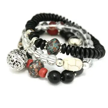 bracelet with black, red, white and silver beads. lava bead inside