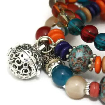 bracelet with multi colored beads and  silver beads. lava bead inside