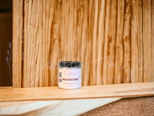 A jar of Unscented Moisturizing Cream with a wood background