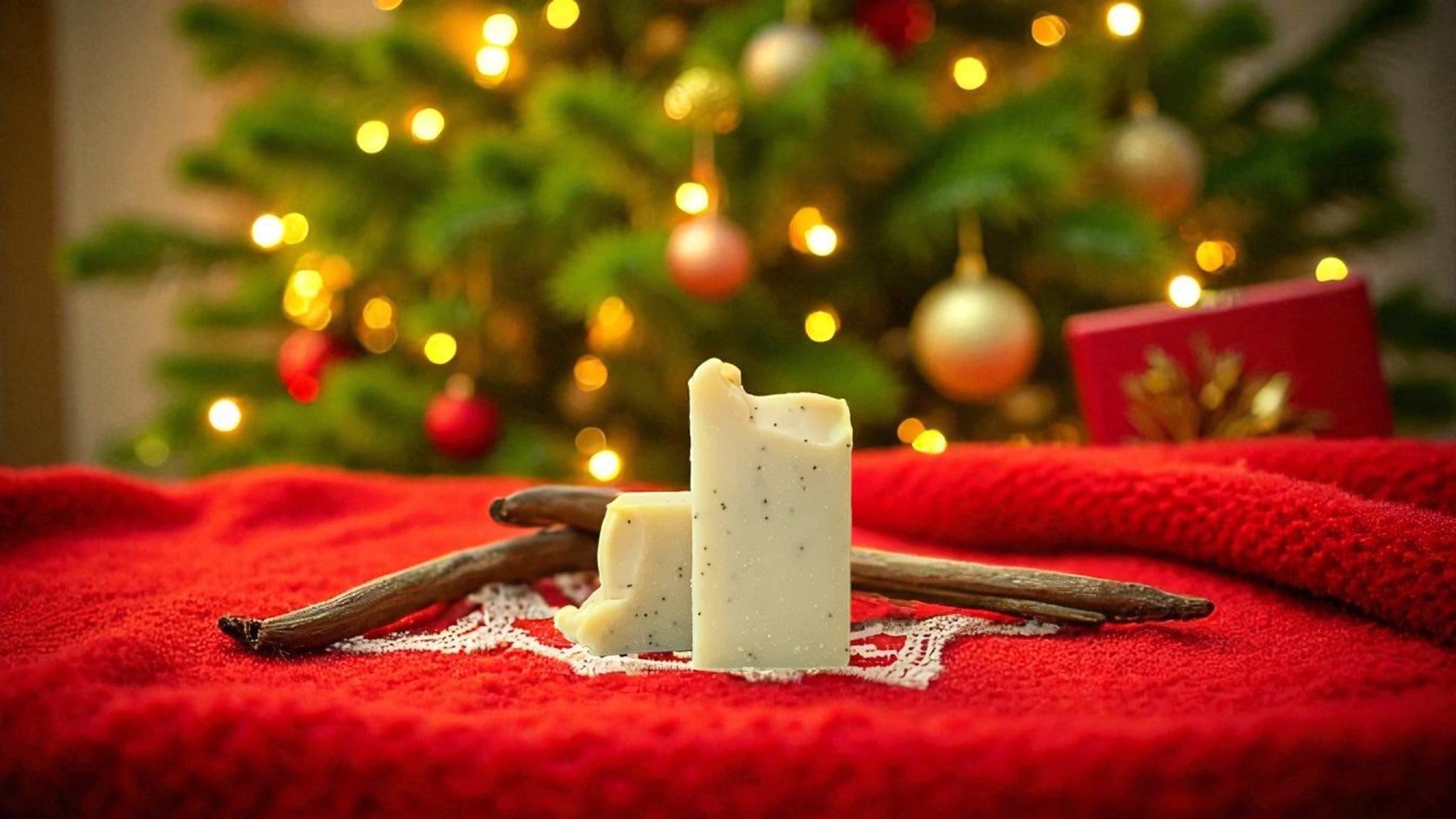 A natural colored bar of soap with accents of poppy seed throughout, with christmas decor in the background
