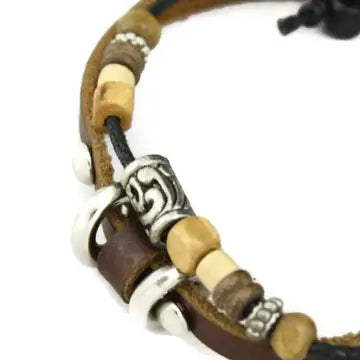 Brown leather bracelet with wooden beads in neutral colors and silver accents