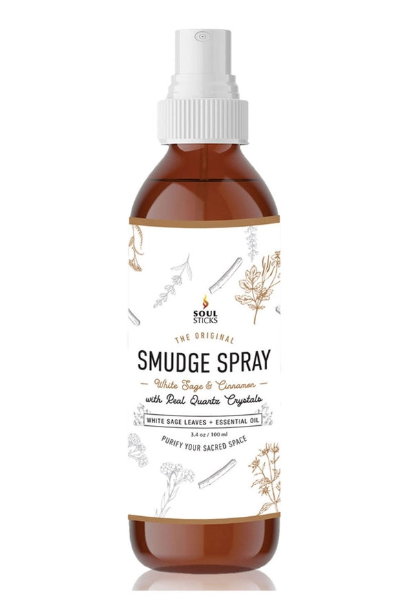 Bottle of white sage & cinnamon smudge spray with a white cap on a white background