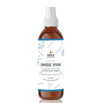 Bottle of white sage & nag champa smudge spray with a white cap on a white background