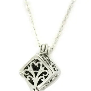 A silver box necklace with lava bead inside. on a silver chain