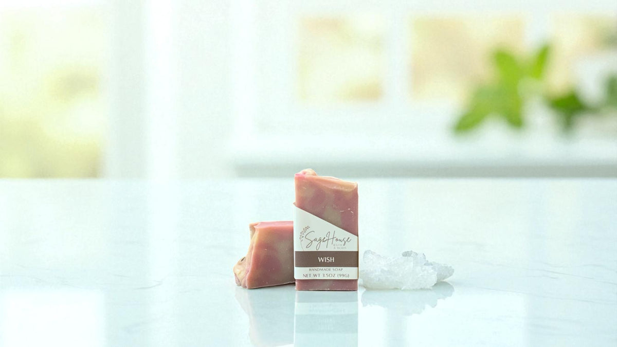 Bar of pink toned soap, on a white countertop with a blurred background