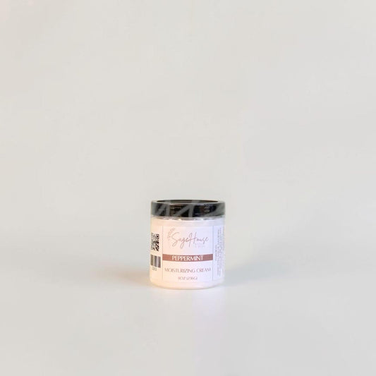 A labeled jar with a black lid. On a neutral background.