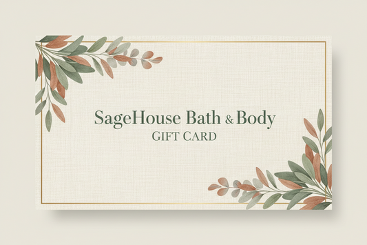 A rectangular SageHouse Bath & Body gift card with a cream linen-textured background, gold border lines, and botanical leaf illustrations in muted green and terracotta tones at the top-left and bottom-right corners. The text reads 'SageHouse Bath & Body' and 'GIFT CARD'.